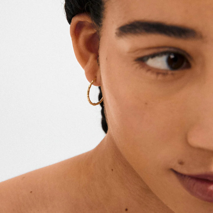 Between Hoop Earrings